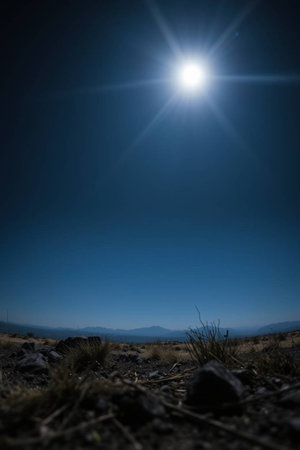 Sunrise in the mountains with rocks and blue sky in the backgroundの写真素材