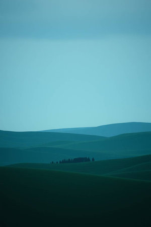 Landscape with green hills and blue sky.の写真素材