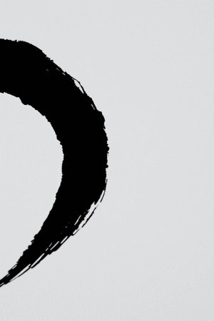 black paint brush stroke on white paper - abstract graphic design and textured backgroundの写真素材