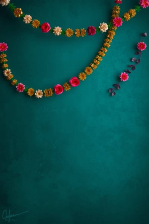 Flower garland on turquoise background with copy space.の写真素材