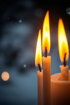 Burning candles on a dark background. Shallow depth of field.の写真素材