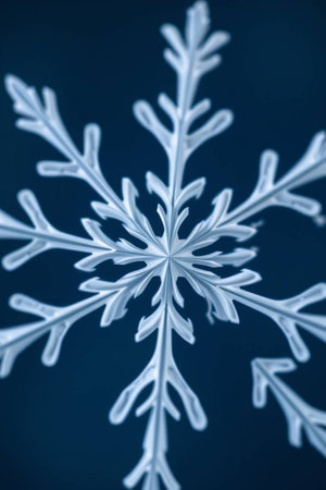 Snowflake on a dark blue background. Macro photo with shallow depth of field.の写真素材