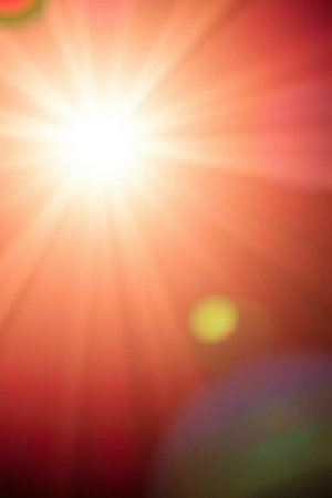 blurred of sun and lens flare on the red background, abstract backgroundの写真素材