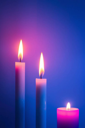 Candles on a blue background. Shallow depth of field.の写真素材