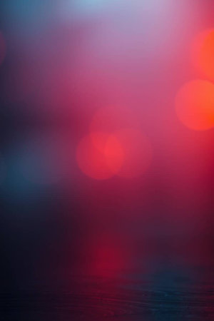 abstract red and blue bokeh background with defocused lights
