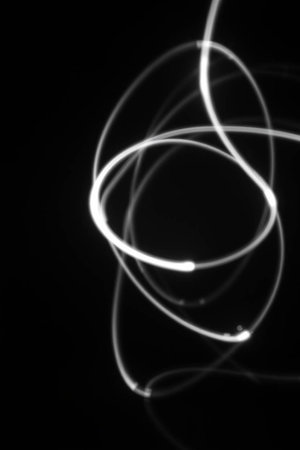 Abstract light painting on black background. Light painting on black background.の写真素材