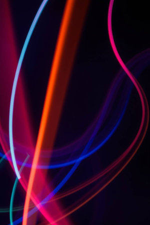 abstract colored lines on a dark background, close-up.の写真素材