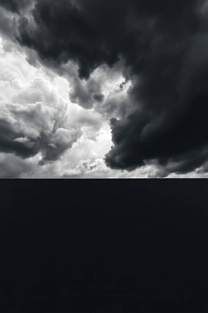 Dark stormy sky with dark clouds. Dramatic sky background.の写真素材