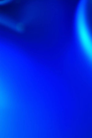 abstract blue background with bokeh defocused lights and shadowの写真素材
