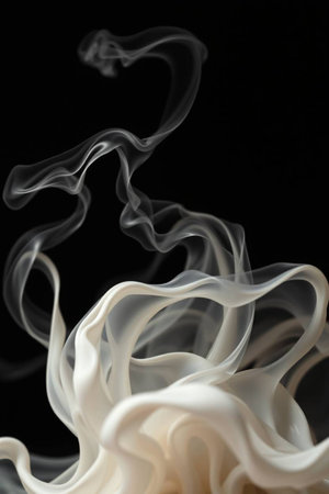 Abstract white smoke on black background. Shallow depth of field.
