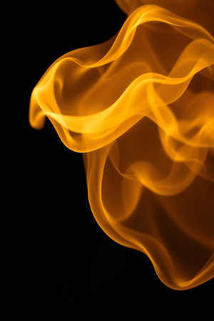 yellow smoke on black background close-up, abstract background for design