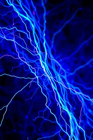 Blue electric lightning in the dark, close-up. Abstract backgroundの写真素材