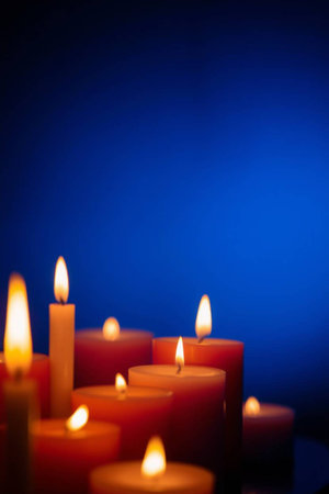Candles on a blue background. Shallow depth of field.の写真素材