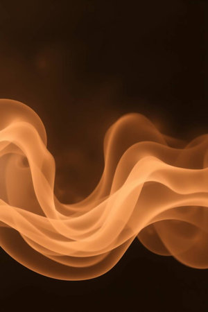 Abstract orange smoke on a black background, close-up, macro