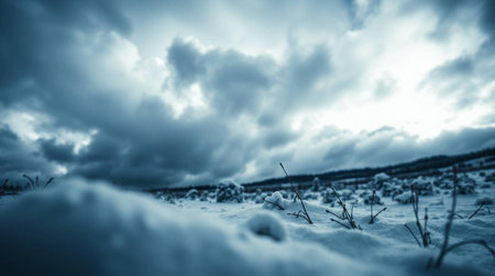 Beautiful winter landscape with snowy field and blue cloudy sky. Long exposure.の写真素材