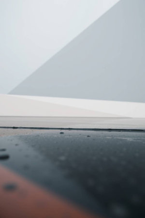 Close up view of a black and white wall with some reflections.の写真素材