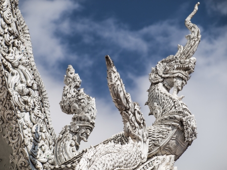 King of nagas's statue on the roof of templeの写真素材