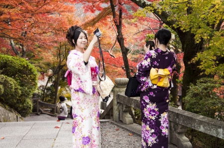 Beautiful Young Japanese Women on Kimono take a photo in Kiyomizudera, Kyoto, Japan, November 22, 2012のeditorial素材