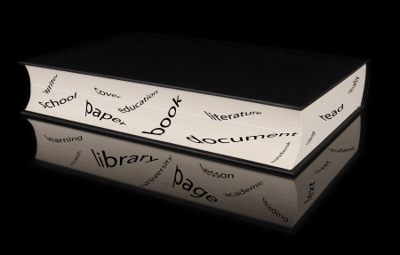 Book with reflection and words related  with study concept over black isolated backgroundの写真素材