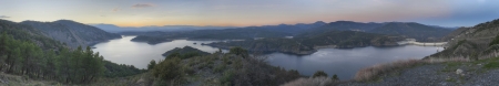 Panoramic landscape of El Atazar Dam at sunset in Madrid, Spain 