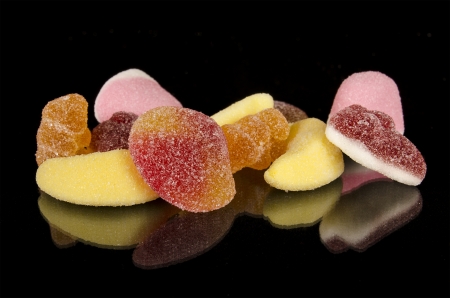 Colorful Candy assortment over black isolated backgroundの写真素材