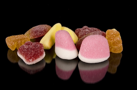 Colorful Candy assortment over black isolated backgroundの写真素材