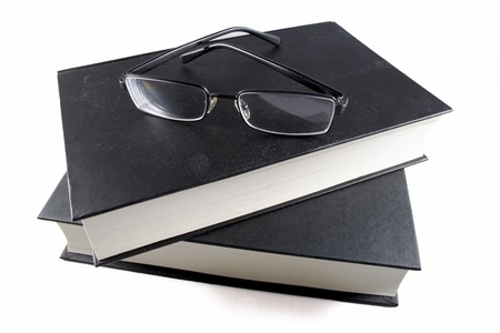 Book and glasses  isolated on white backgroundの写真素材