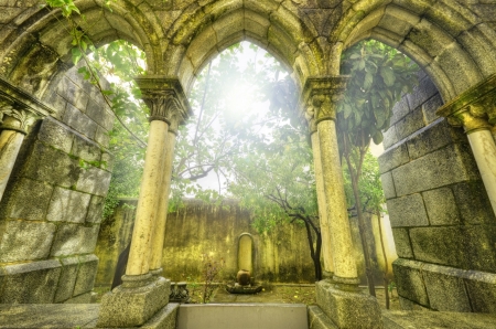 Ancient gothic arches in the myst. Fantasy landscape in Evora, Portugal.の写真素材