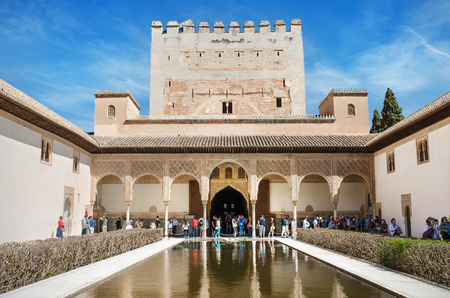GRANADA, SPAIN - APRIL, 30: Some tourist are visiting a courtyard in the famous Alhambra palace in Granada, Spain. on April 30, 2014.のeditorial素材