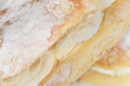 Delicious cream pastry macro picture, selective focus on the cream.の写真素材