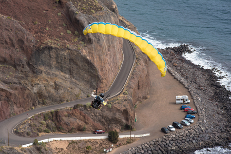 SANTA CRUZ DE TENERIFE, SPAIN - JANUARY 30: Breathtaking view of an unidentified pilot flying with a paraglider on January 30, 2016 in Santa Cruz de Tenerife, Tenerife, Spain.のeditorial素材