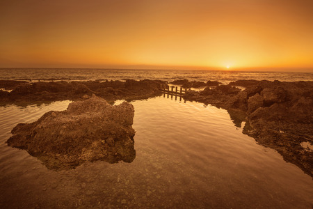 Idyllic golden sunset in the ocean. Alcala, Tenerife, Canary island, Spain.のeditorial素材