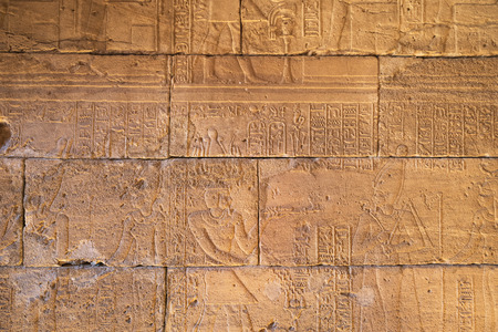 Real Hieroglyphic carvings on the walls of an ancient egyptian temple.の写真素材
