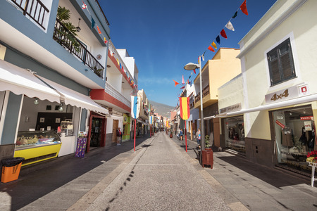 CANDELARIA, SPAIN - JANUARY 30: Some tourist are walking in a commercial street on January 30, 2016 in Candelaria, Tenerife, Spain. Candelaria is a famous touristic town in Tenerife, Canary islands, Spain.のeditorial素材