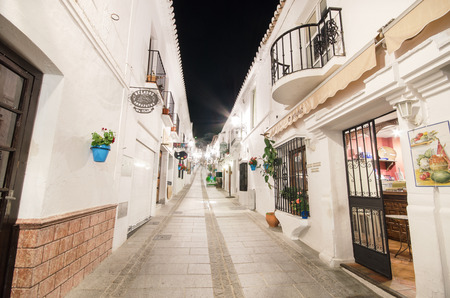 Typical street at night in the famous white village of Mijas, Malaga, Spain.のeditorial素材