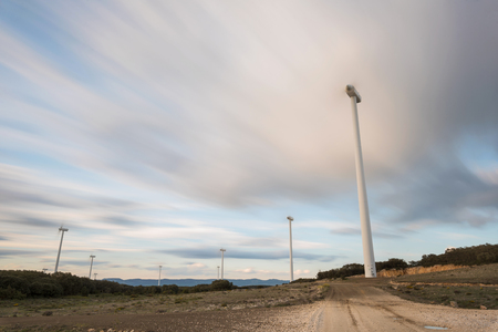 Long exposure of a windmill rotating at dusk