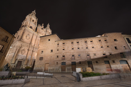 Night scene of Clerecia church and casa de las conchas at night, famous landmarks in Salamanca, Spain.の写真素材