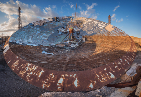 Ruined setellite dish antenna in south Tenerife, Canary islands, Spain.の写真素材