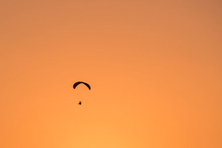 Paraglide shilouette at sunsetの写真素材