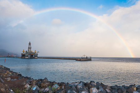 Santa Cruz de Tenerife, Spain - February 8, 2018 : Scenic view of a rainbow on a rainy day in Tenerife port, Canary islands, Spain.のeditorial素材