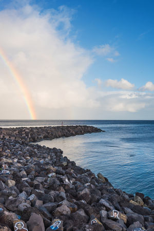 Santa Cruz de Tenerife, Spain - February 8, 2018 : Scenic view of a rainbow on a rainy day in Tenerife port, Canary islands, Spain.のeditorial素材