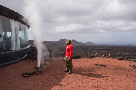 Lanzarote, Spain - February 12, 2018: Artificial volcanic geyser demonstration in Timanfaya volcanic national park in Lanzarote, Canary islands, Spain. のeditorial素材