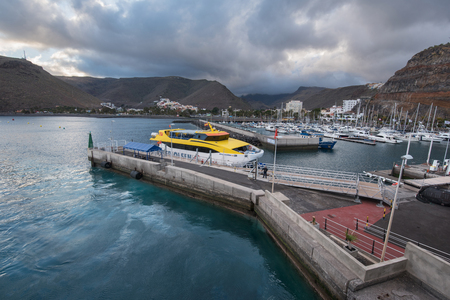 La Gomera, Spain - May 29, 2018: Yatchs and Ferry in San Sebastian de la gomera port on May 29, 2018, Canary islands, Spain.のeditorial素材