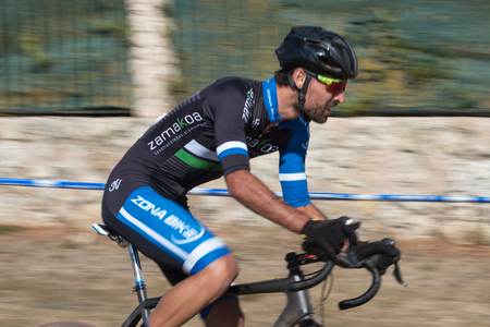 Burgos, Spain - October 12, 2017: A cyclist competes in Fresno de Rodilla II Cyclocross event in Burgos, Spain.のeditorial素材
