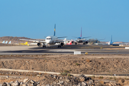 Tenerife, Spain - August 26, 2016: Airplanes waiting for take off in Tenerife south airport, Canary islands, Spain.のeditorial素材
