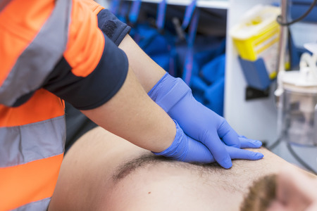 Emergency doctor resuscitate a patient in ambulance. CPR resuscitation.の写真素材