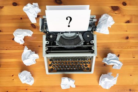 Typewriter and crumpled paper on work desk. Creative process conceptの写真素材