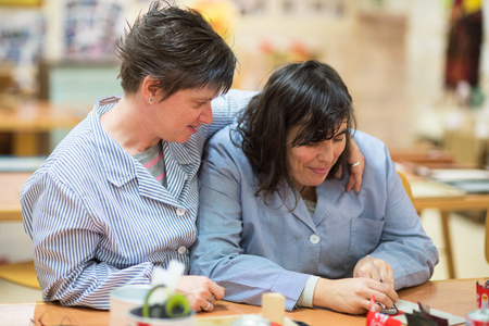 Briviesca, Spain - November 7, 2018: People with special needs or disability working with their teachers at workshop of occupational therapyのeditorial素材