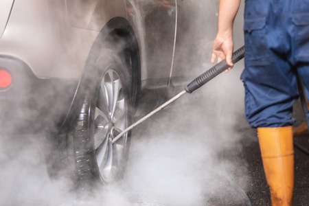 Manual car wash with pressurized water in car wash outside.の写真素材