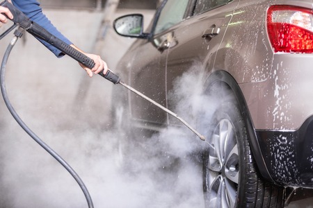 Manual car wash with pressurized water in car wash outside.の写真素材